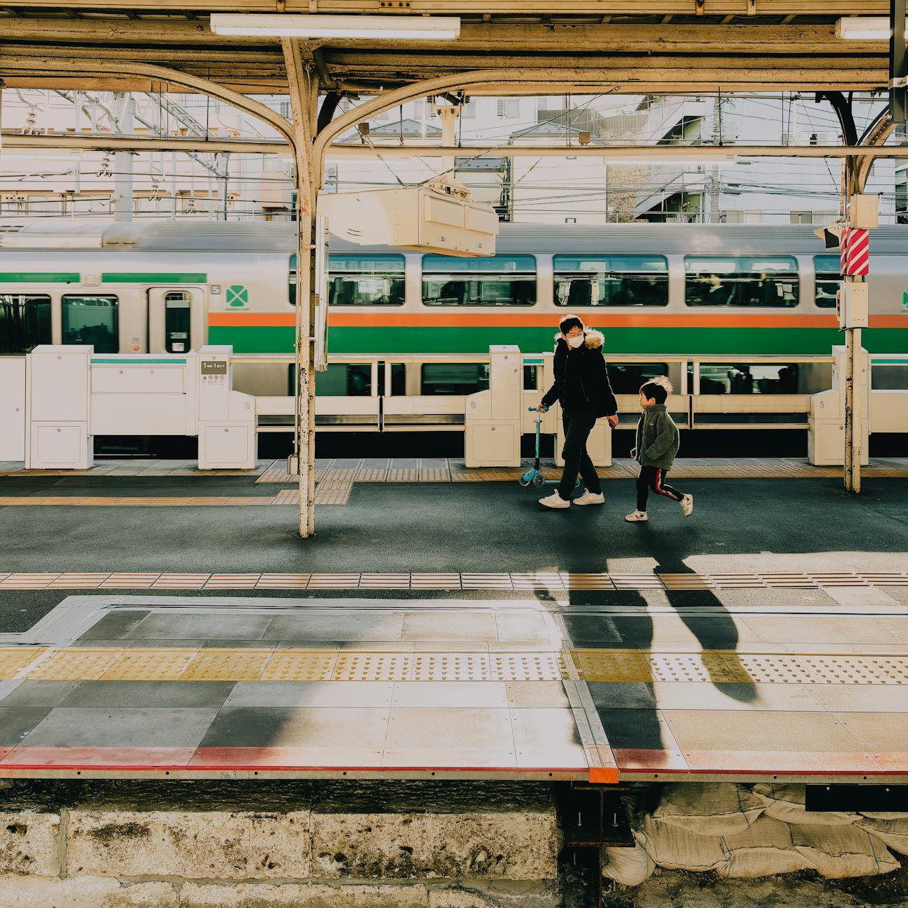 Photo by Gu Ko | via Pexels | License: Pexels License | https://www.pexels.com/photo/father-and-son-walking-at-tokyo-train-station-32181831/