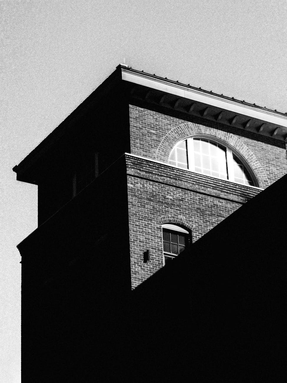 Photo by Connor McManus | via Pexels | License: Pexels License | https://www.pexels.com/photo/black-and-white-vintage-brick-building-exterior-34793128/