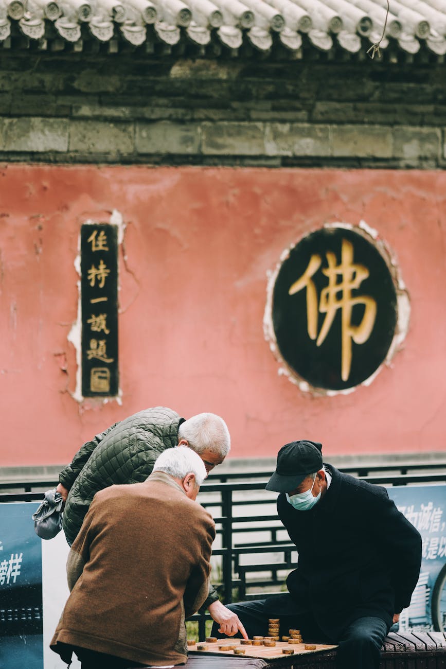 Photo by zhang kaiyv | via Pexels | License: Pexels License | https://www.pexels.com/photo/elderly-men-playing-chinese-chess-in-beijing-16228208/