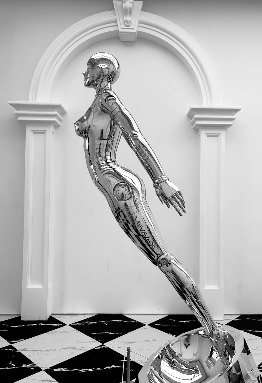 Photo by Ran Hua | via Pexels | License: Pexels License | https://www.pexels.com/photo/futuristic-chrome-robot-sculpture-indoors-31466673/