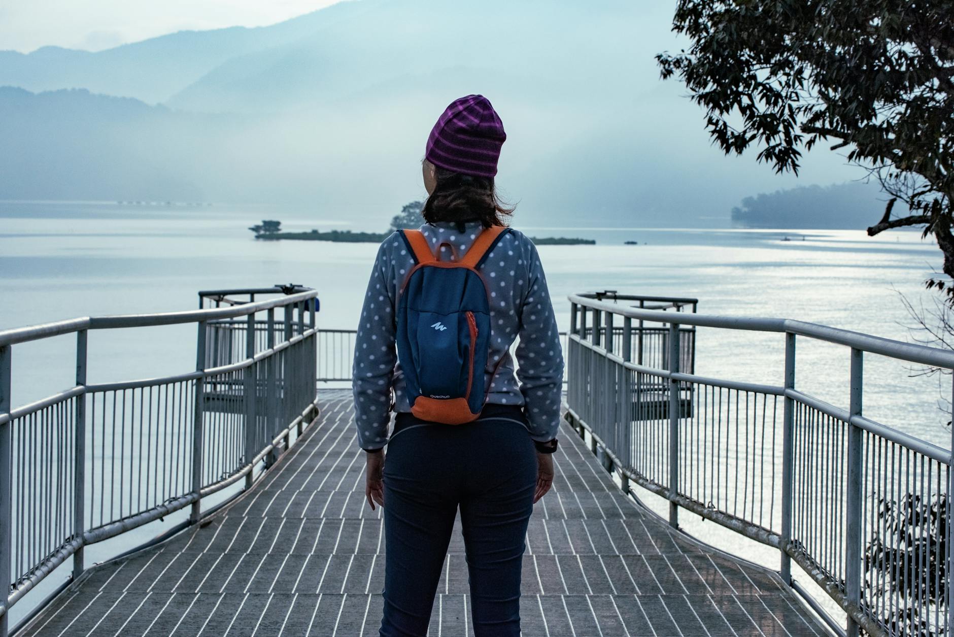 Photo by Daven Hsu | via Pexels | License: Pexels License | https://www.pexels.com/photo/woman-enjoying-scenic-view-at-sun-moon-lake-35066771/