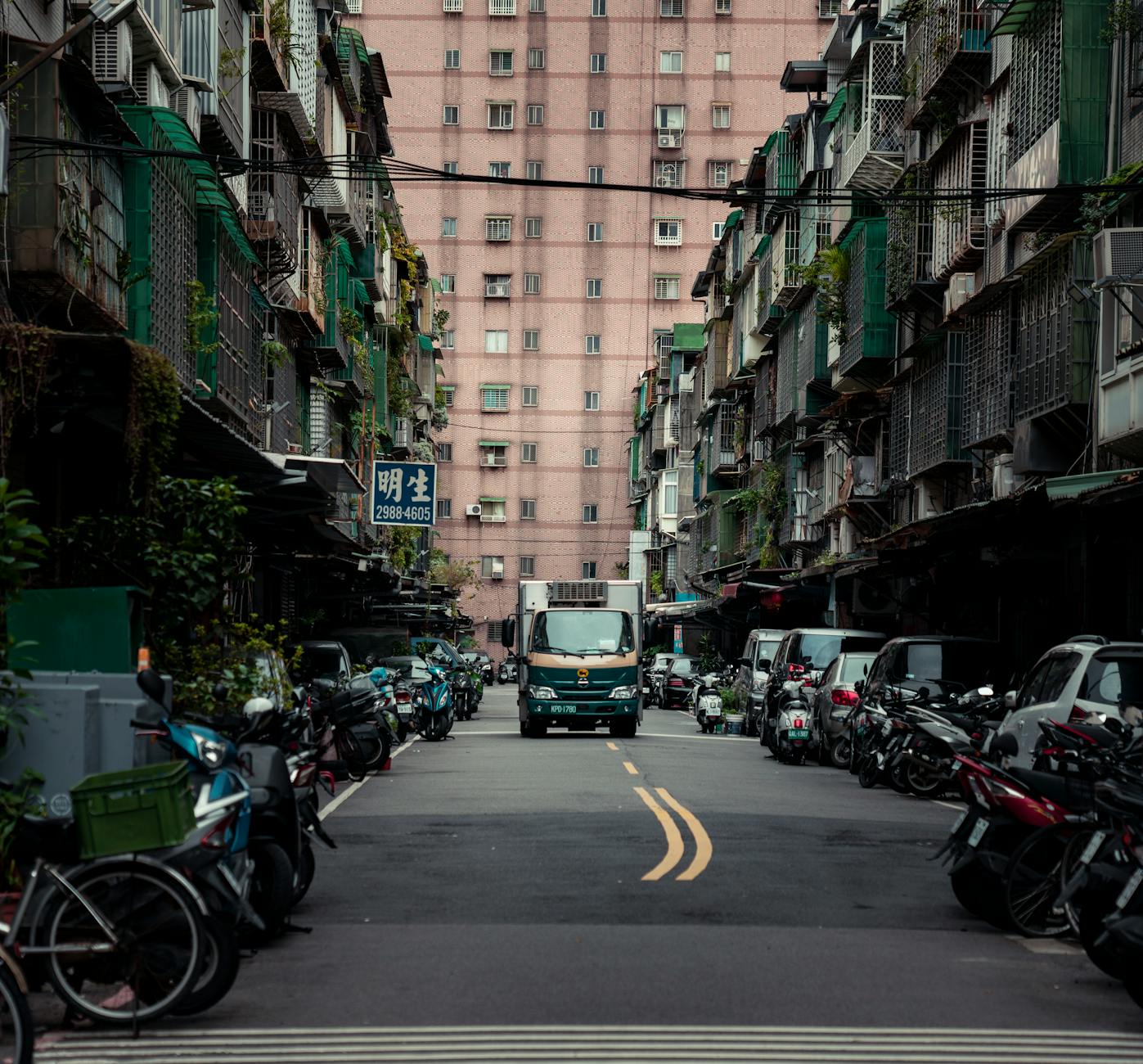 Photo by Jimmy Liao | via Pexels | License: Pexels License | https://www.pexels.com/photo/urban-street-in-new-taipei-city-with-alley-perspective-35067722/