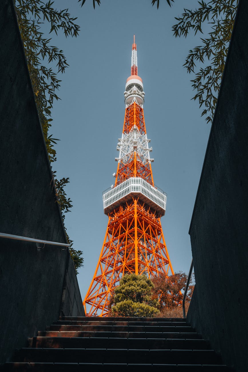 Photo by Sarmat Batagov | via Pexels | License: Pexels License | https://www.pexels.com/photo/tokyo-tower-framed-by-dark-staircase-perspective-35282201/