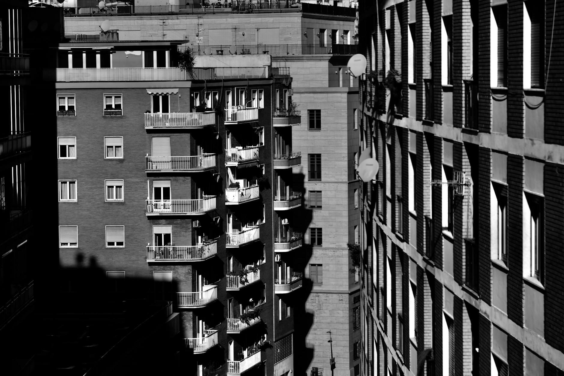 Photo by Chen Te | via Pexels | License: Pexels License | https://www.pexels.com/photo/grayscale-photo-of-apartment-buildings-10165535/