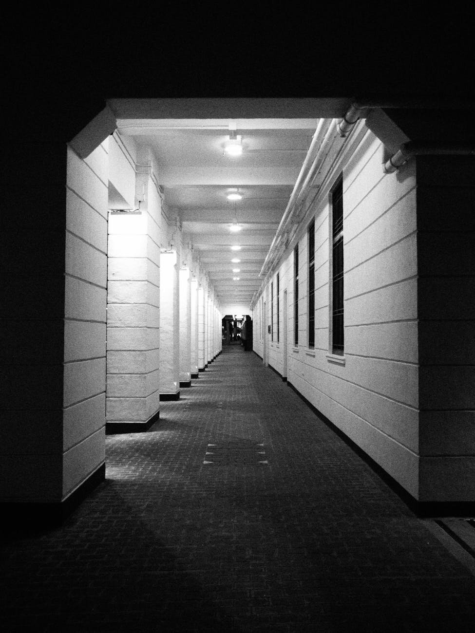 Photo by terry narcissan tsui | via Pexels | License: Pexels License | https://www.pexels.com/photo/black-and-white-corridor-in-hong-kong-architecture-35622386/