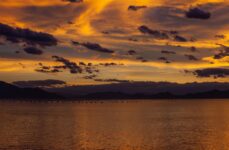 Photo by Dennis Ariel | via Pexels | License: Pexels License | https://www.pexels.com/photo/silhouetted-mountains-and-a-body-of-water-at-sunset-19643249/